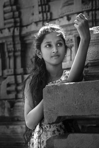 Teen model posing on temple background 