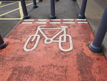 High angle view of bicycle lane sign on road