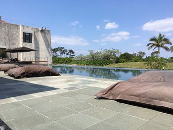 Scenic view of swimming pool against blue sky