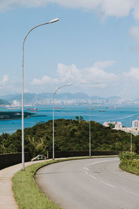 Street by sea against sky