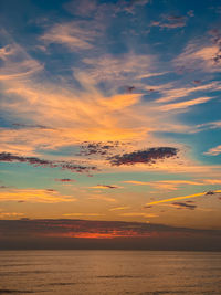 Beautiful dramatic sunset over ocean with clouds in del mar, california.