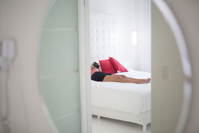 Woman looking through window