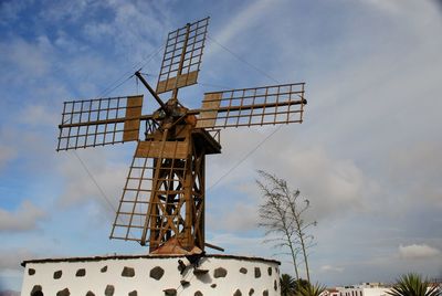 Windmill in fuerteventura. low angle view of building against sky