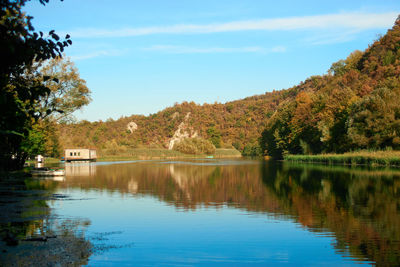 Scenic view of lake against sky during autumn