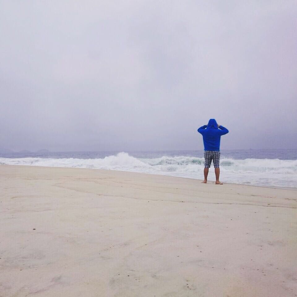 SCENIC VIEW OF CALM BEACH AGAINST SKY