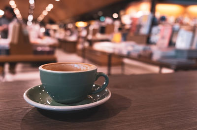 Close-up of coffee served on table at cafe