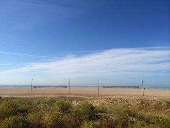 View of beach against cloudy sky