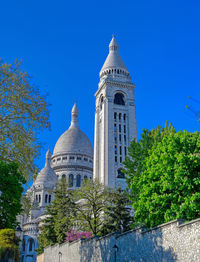 Low angle view of building against clear blue sky