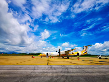 Scenic view of airport runway against sky