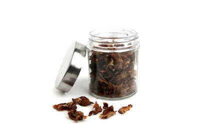 Close-up of drink in jar against white background
