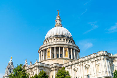 Low angle view of building against blue sky