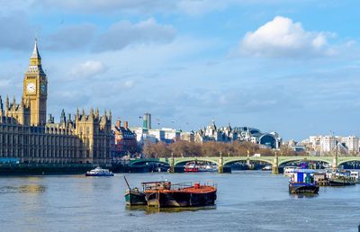 Boats on the river thames against the westminster palace and bridge, london