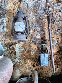 Low angle view of old electric lamp on wall