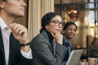 Businesswoman using smart phone in office