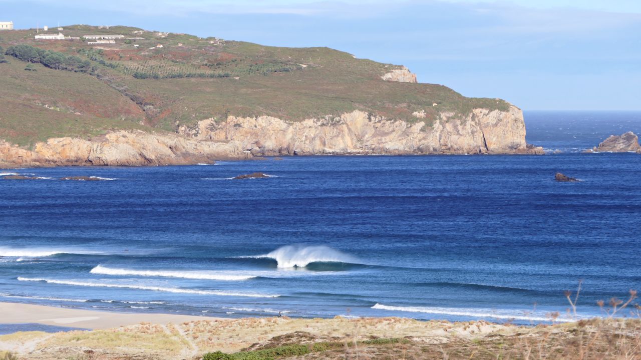 SCENIC VIEW OF SEA AND MOUNTAIN