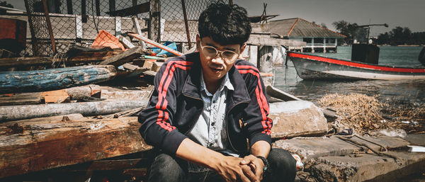 Young man sitting outdoors