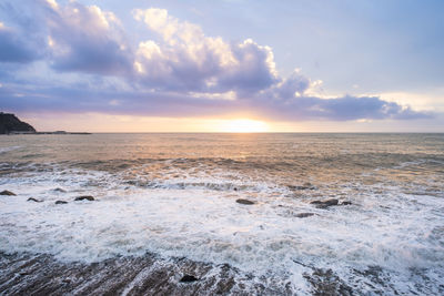 Scenic view of sea against sky during sunset