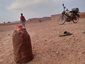 Man riding motorcycle on sand
