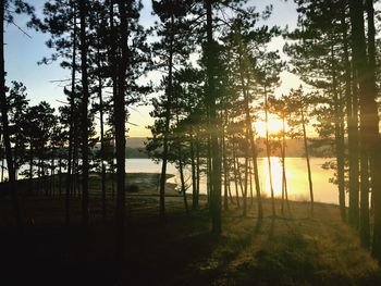 Scenic view of lake against sky at sunset