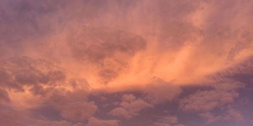 Low angle view of dramatic sky during sunset