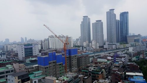 Modern buildings in city against sky