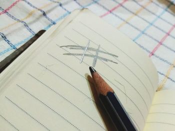 High angle view of pen on paper