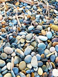 Multi-colored stones fill the shore of this beach in carlsbad, ca