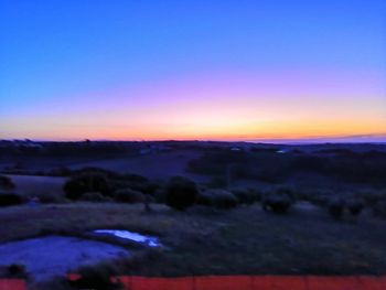 Scenic view of dramatic sky during sunset