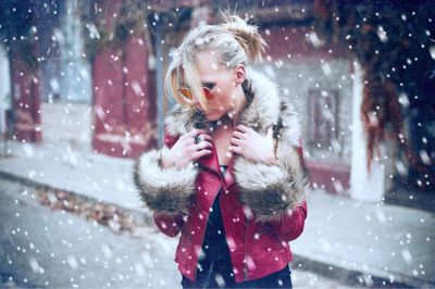 Portrait of young woman in snow