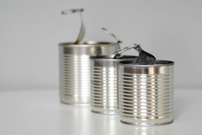 Close-up of glasses on table against white background