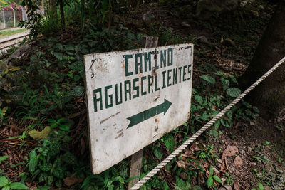 High angle view of information sign on field