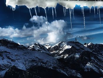 Panoramic view of snowcapped mountains against sky