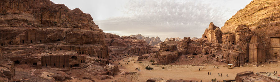 Panoramic view of rock formations against sky during sunset