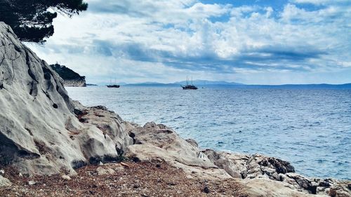 Scenic view of sea against cloudy sky