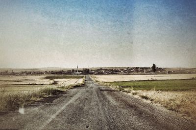 Road passing through field