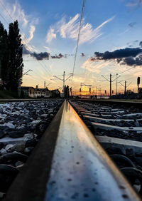 Surface level of railroad tracks against sky