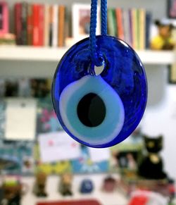 Close-up of christmas decorations hanging on blue