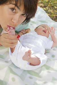 Cute baby girl lying on bed