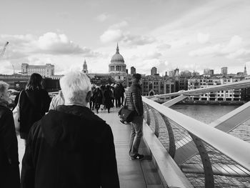 People walking on london millennium footbridge 