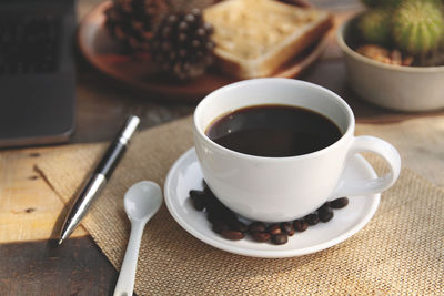 Close-up of coffee cup on table