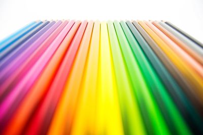 Close-up of colorful balloons over white background