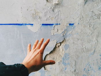 Human hand on wall