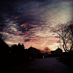 Built structure against cloudy sky at sunset