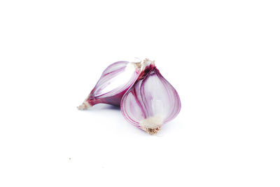 Close-up of purple cream over white background