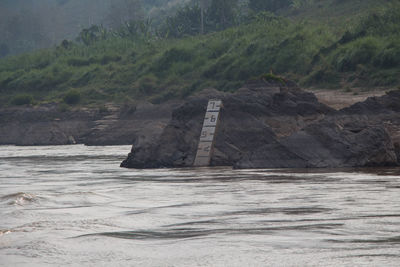 Scenic view of sea against mountain