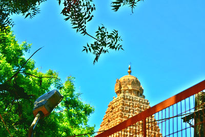 Low angle view of built structure against clear blue sky