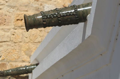 Close-up of pipes against wall