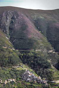 Aerial view of landscape with mountain range in background