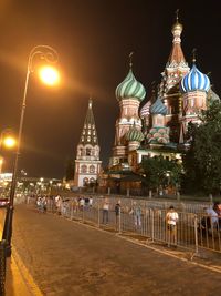 Illuminated buildings in city at night