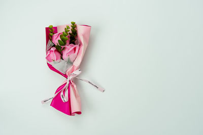 High angle view of pink umbrella on white background